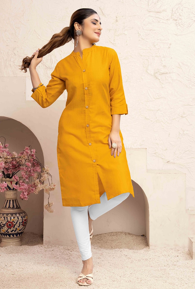 Mustard yellow cotton casual kurti with functional pockets, styled for everyday wear