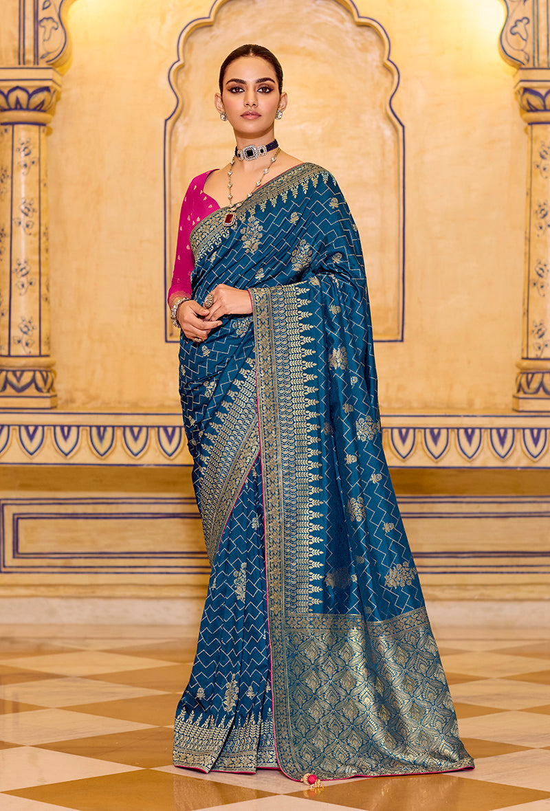 Elegant teal blue faux crepe silk saree with intricate zari weaving work and matching unstitched blouse