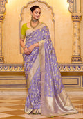 Lavender faux crepe silk saree with elegant Zari weaving work and a soft, flowing drape.