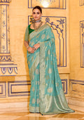 Sea green faux crepe silk saree with elegant Zari weaving details