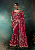 Burgundy faux crepe saree with heavy embroidered border for weddings and bridal events