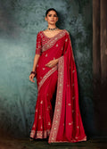 Red bridal saree with heavy border and intricate embroidery