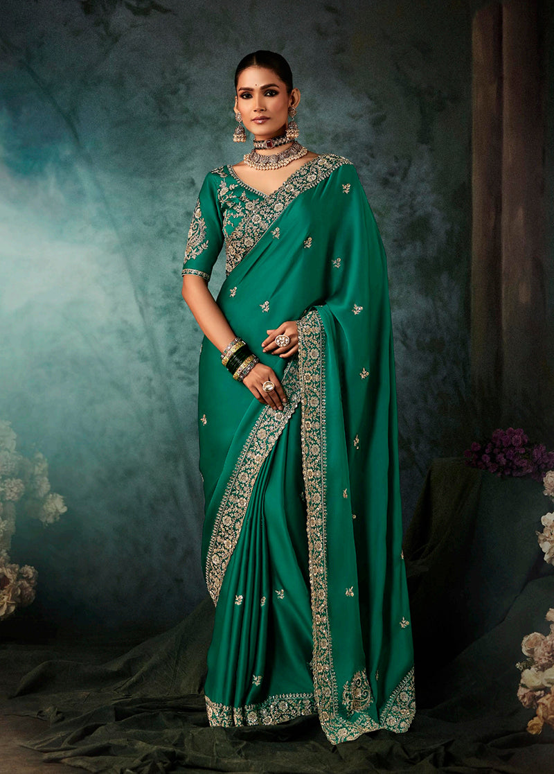 Teal green faux satin wedding saree with heavy embroidery and decorative border