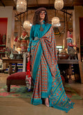 Aqua Blue and Rust silk blend saree with Ikat print and contrast border