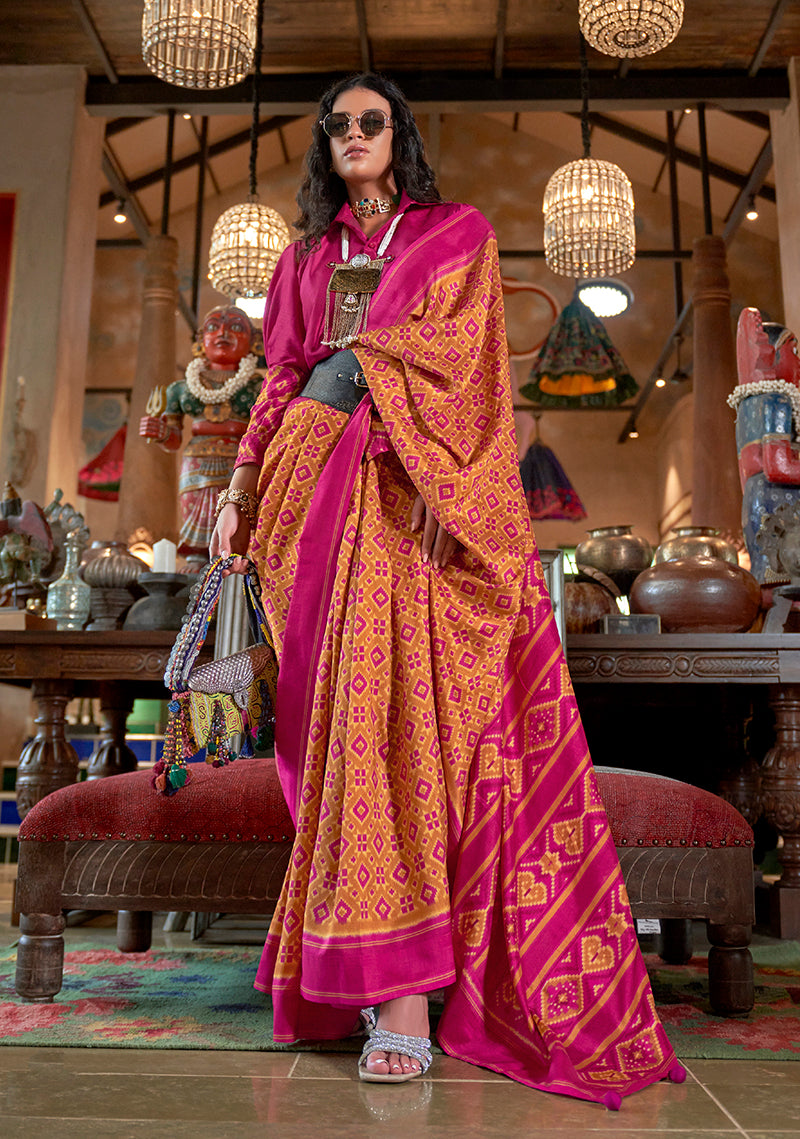 Mustard and Magenta Pink silk blend saree with Ikat print and contrast border.