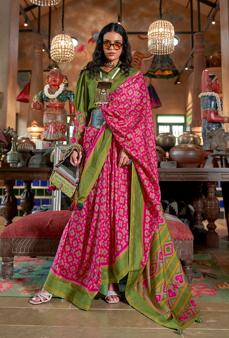 Rani pink and green ikat print silk blend saree with contrast border