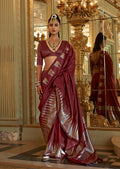 Classic Maroon silk blend saree with detailed traditional weaving work.