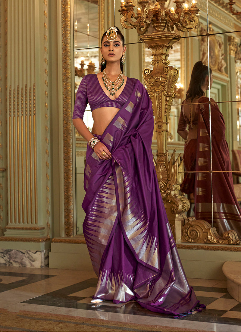 Purple silk blend saree showcasing intricate traditional weaving patterns.