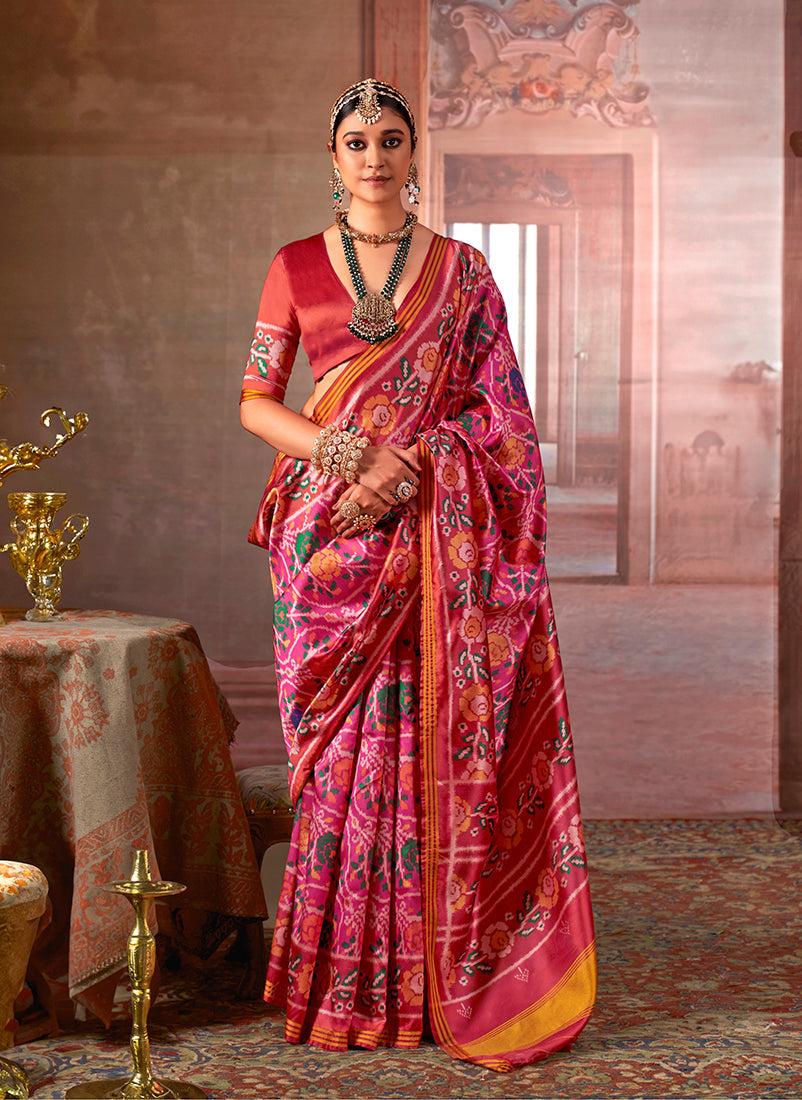 Pink silk blend saree with traditional Patola print and contrast red blouse