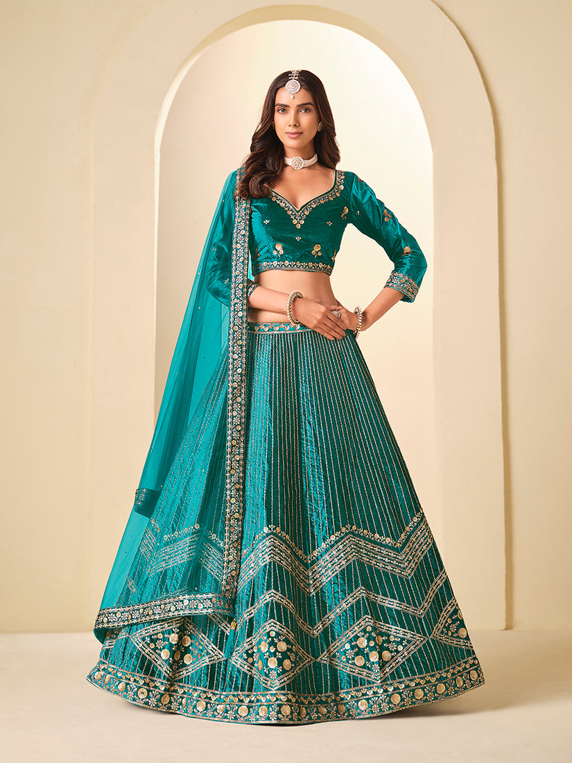Teal velvet A-line lehenga choli adorned with shimmering sequins embroidery.
