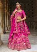 Magenta Pink bridal lehenga choli featuring delicate Khatli embroidery and silk blend texture