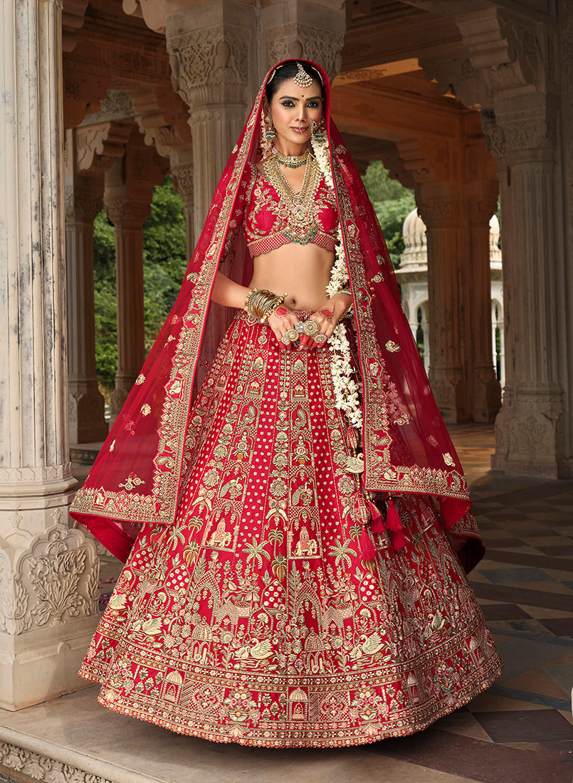Model wearing a vibrant red silk blend bridal lehenga with detailed Khatli embroidery