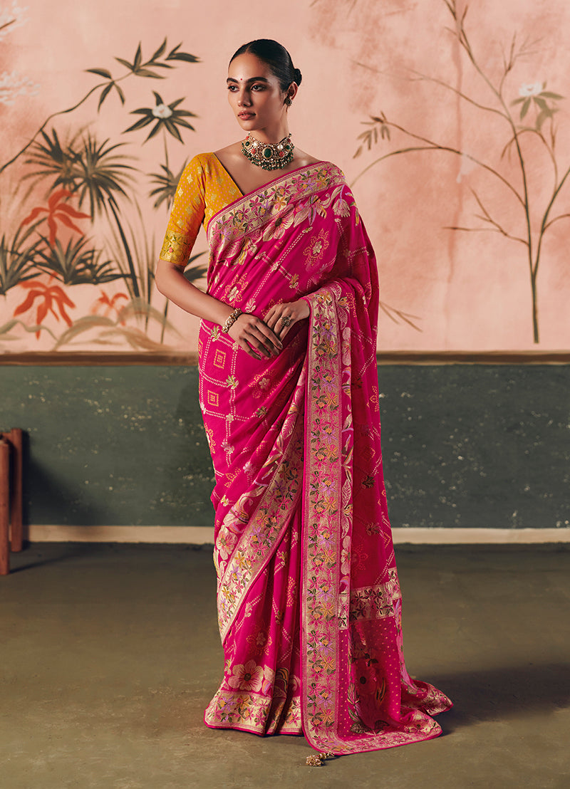 A stunning Rani Pink faux khadi georgette saree featuring intricate Bandhej tie-dye and designer weaving work.