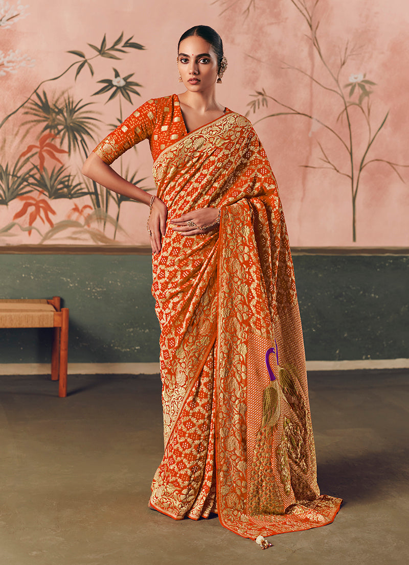 Close up of orange Bandhej weave pattern on faux khadi georgette saree fabric