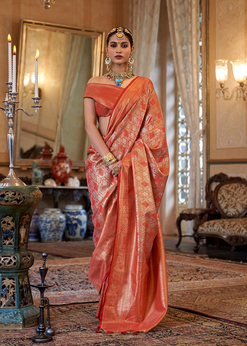 Orange Kanjivaram silk blend saree with intricate woven traditional patterns