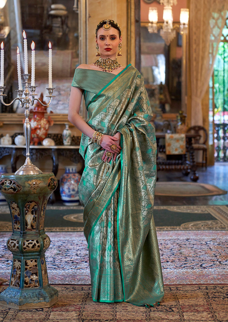 Teal Kanjivaram silk blend saree with traditional woven details