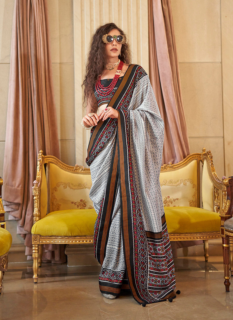 Elegant grey silk blend party saree with foil print detailing