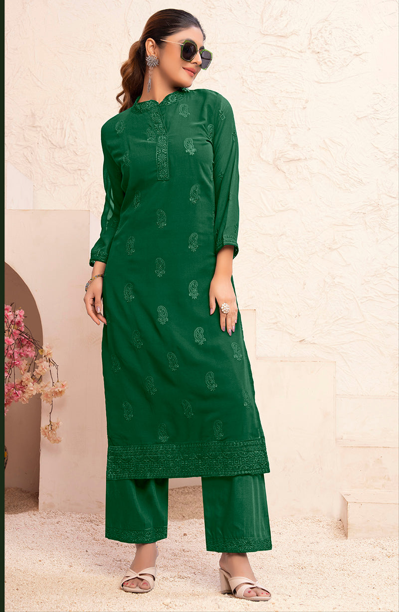 Dark green georgette pant style suit with intricate embroidery details for festive occasions