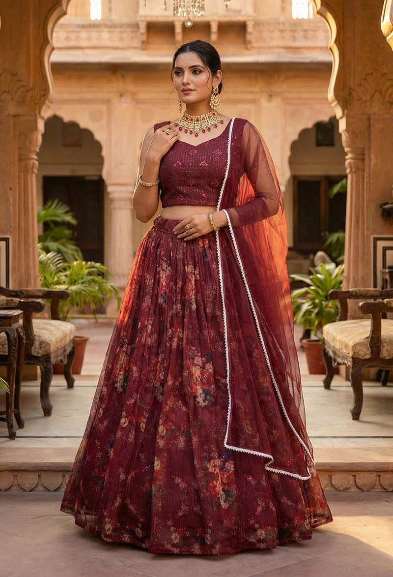 Wine colored floral organza lehenga choli with designer blouse.