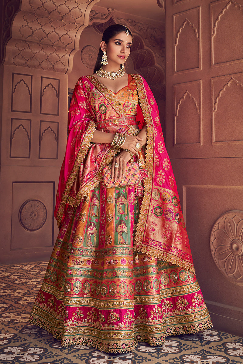Multi-colored Banarasi silk blend lehenga choli with Swarovski and sequins embroidery.
