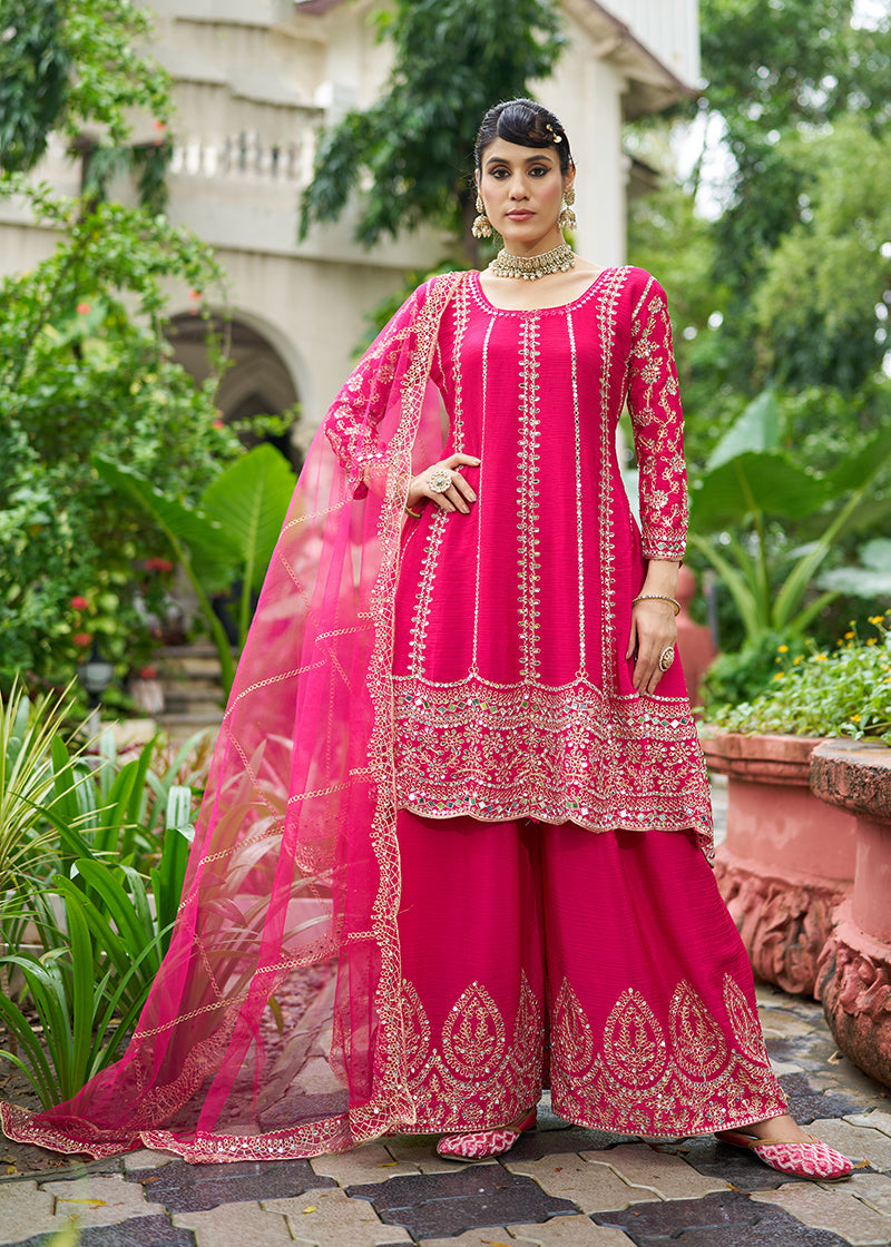 A beautiful Rani Pink Chinnon palazzo kameez featuring intricate mirror work and embroidery for festival wear.