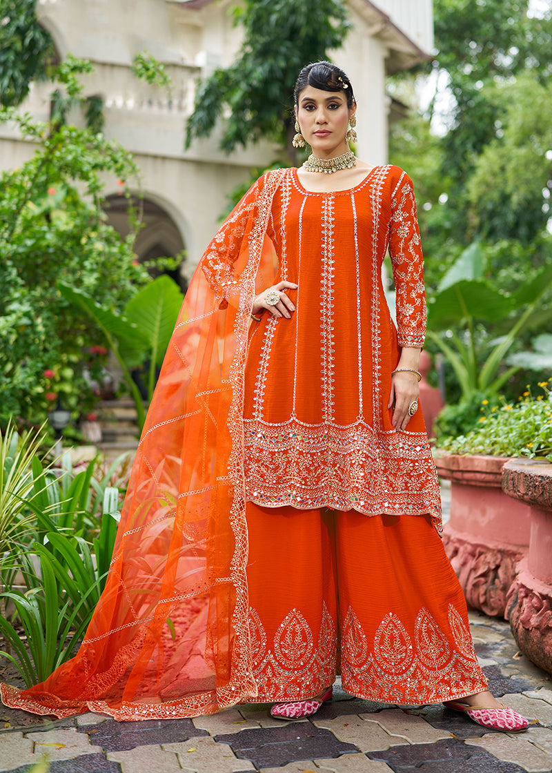 Orange Chinnon palazzo kameez featuring festive mirror work and embroidery