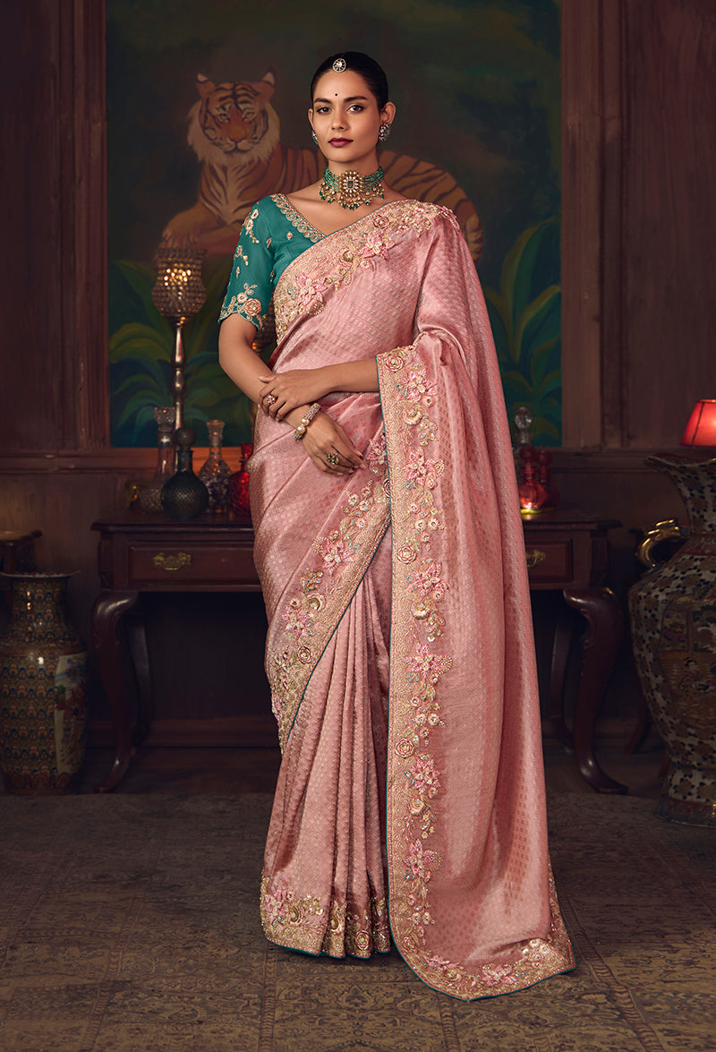 Pink silk blend saree with zari embroidery and teal blue blouse for wedding wear