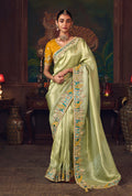 Light green silk blend wedding saree with zari weaving and contrasting mustard embroidered blouse