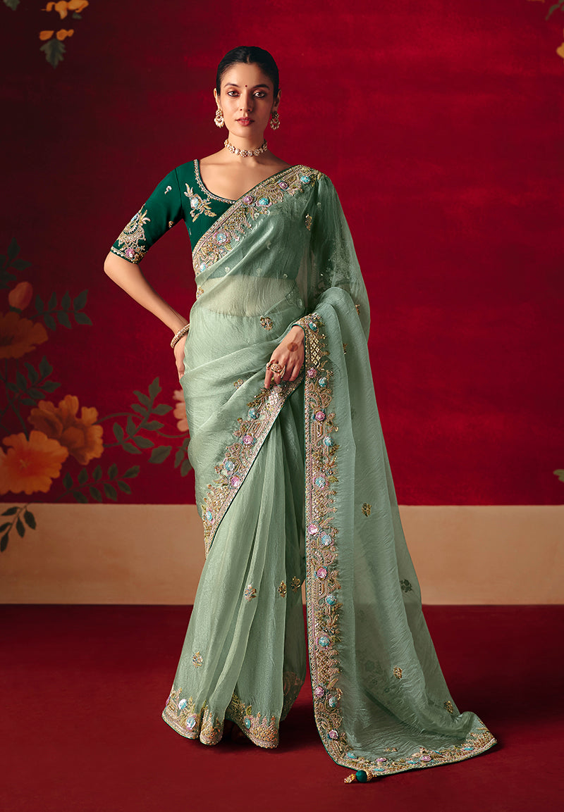 Sea green fancy fabric saree with intricate sequins and thread work embroidery