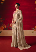 Beige classic saree featuring intricate embroidery, sequins, and thread work detailing