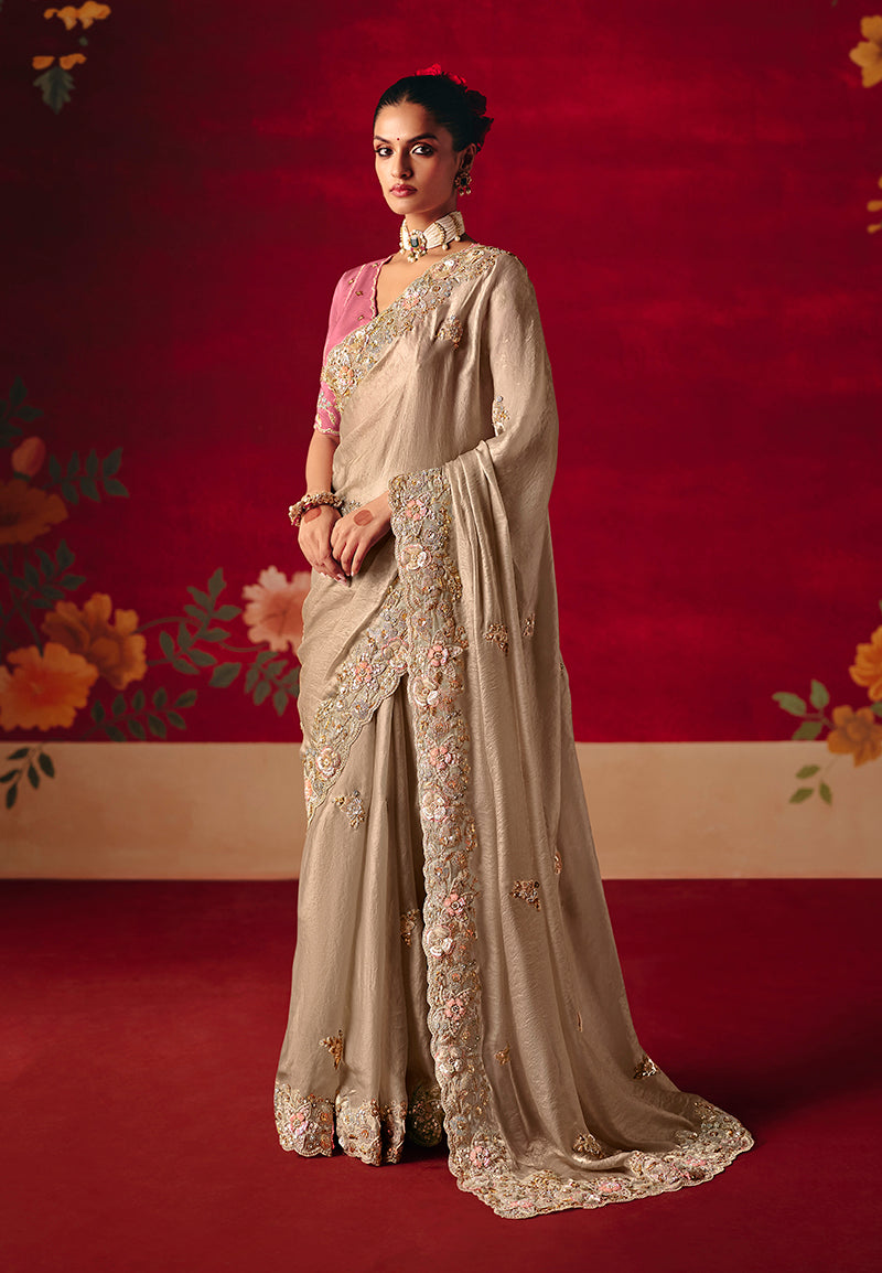 Beige classic saree featuring intricate embroidery, sequins, and thread work detailing