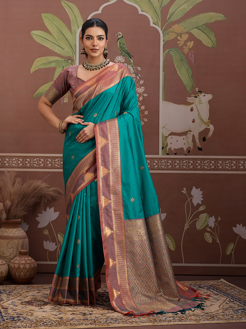 Close-up of a turquoise Tussar silk saree featuring traditional weaving patterns