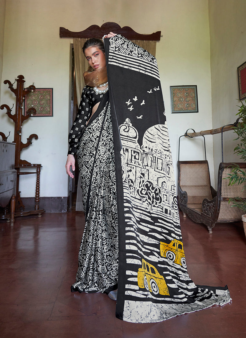 Black satin printed saree with a smooth finish and elegant ethnic print