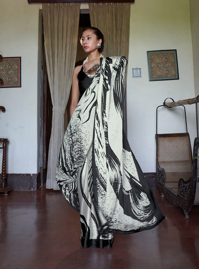 Monjolika Fashion Black and White satin printed saree with ethnic patterns