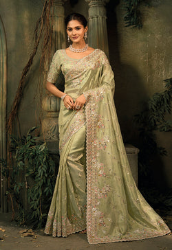 Pista Green Silk Blend Saree adorned with intricate Jari and Cut-Dana embroidery.