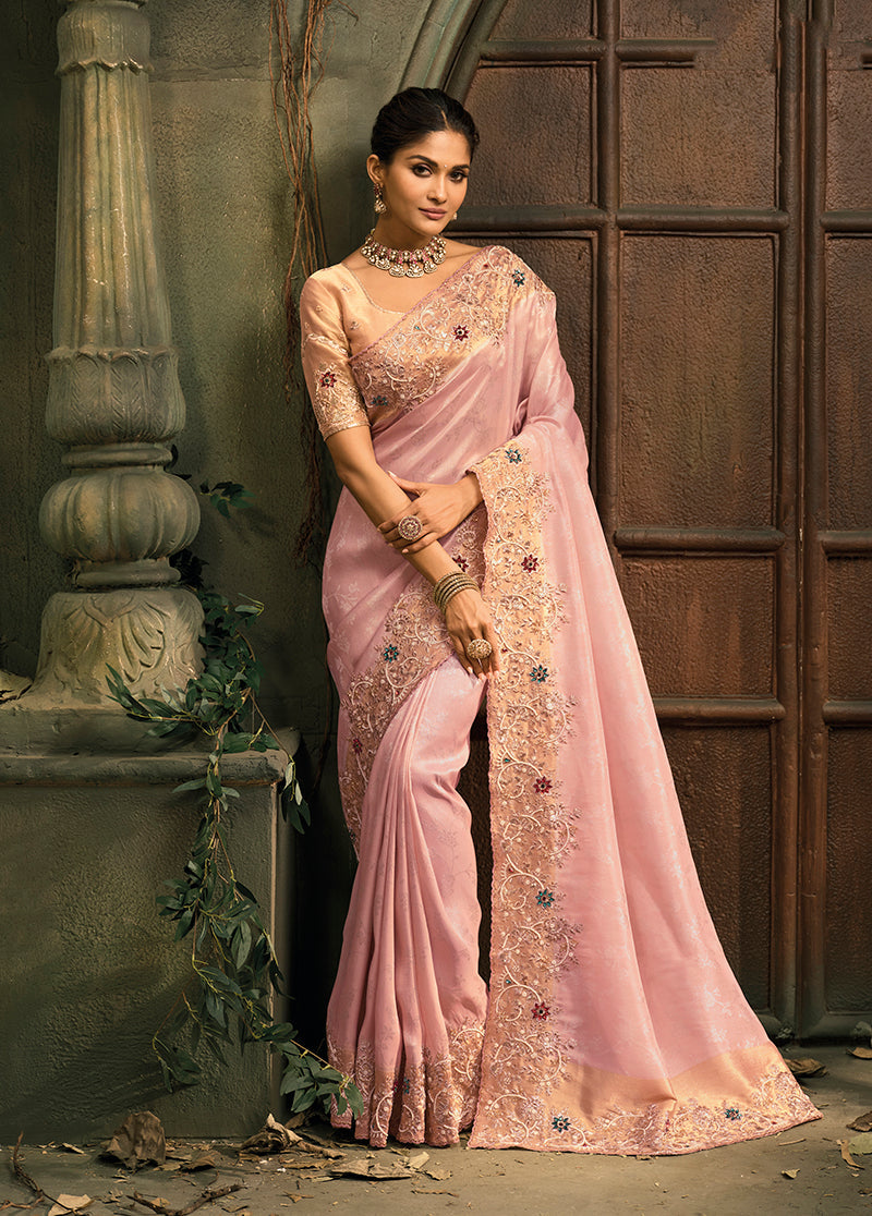 A beautiful pink silk blend saree featuring detailed jari embroidery and cut-dana work.