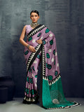 Lilac satin printed saree with a smooth, shimmering finish
