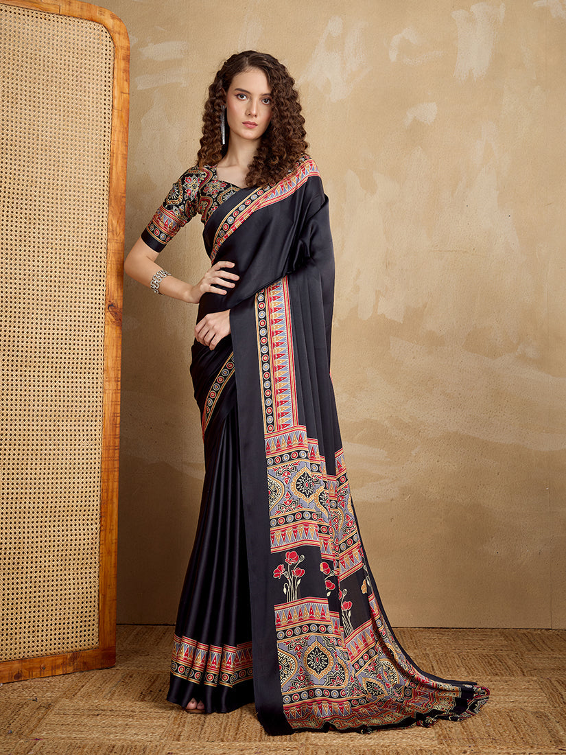 Monjolika Fashion black satin saree with vibrant multi-colored printed border and pallu