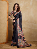 Monjolika Fashion black satin saree with vibrant multi-colored printed border and pallu
