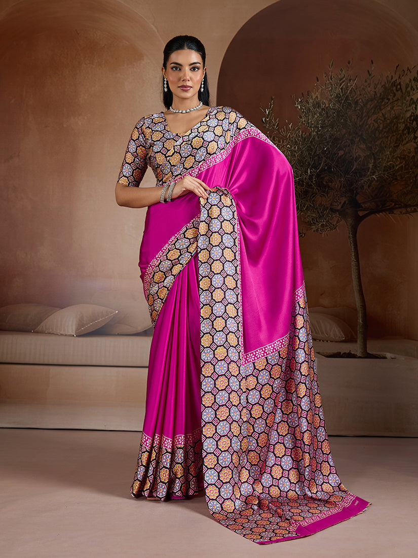 Magenta printed satin saree with a glossy finish and vibrant pallu details