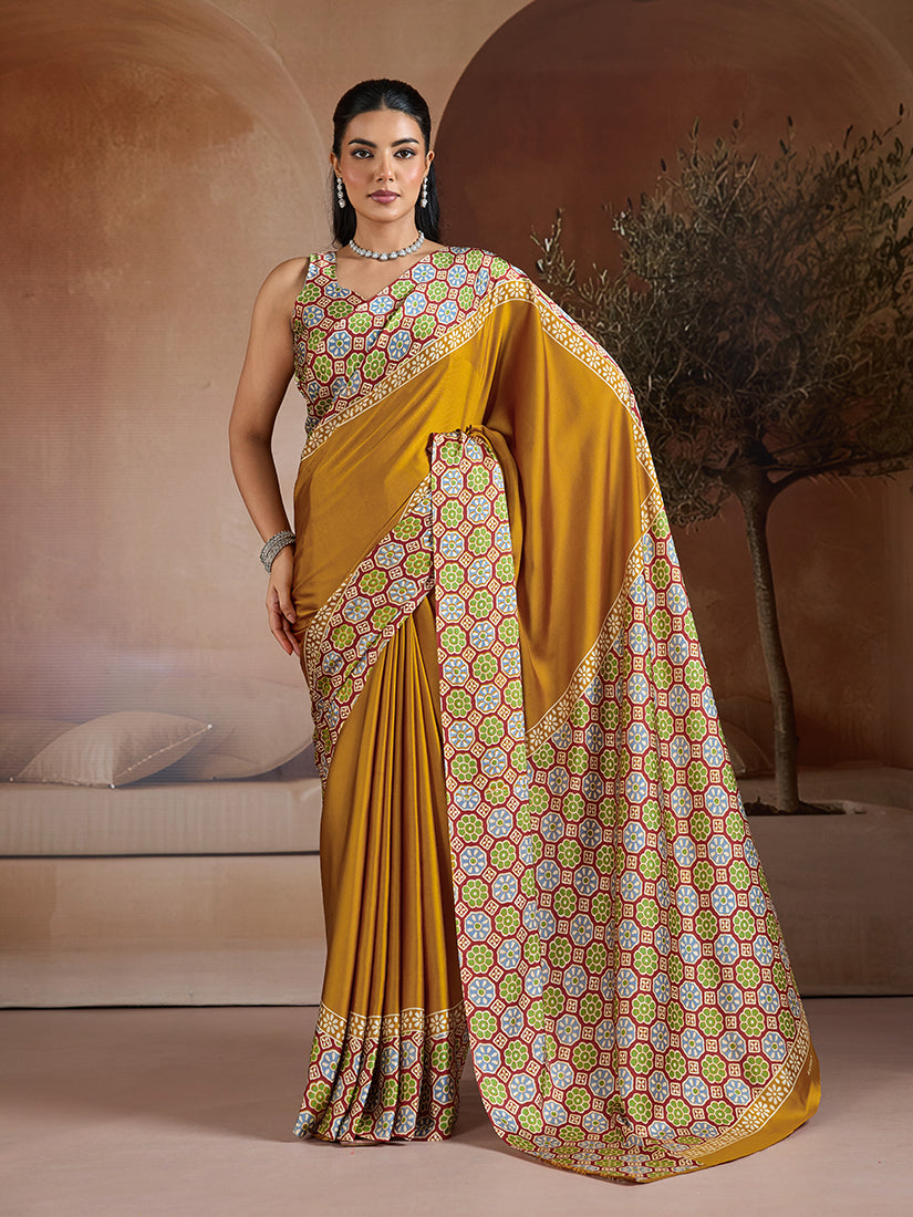 Mustard and black printed satin saree with a luxurious sheen and contrast pallu