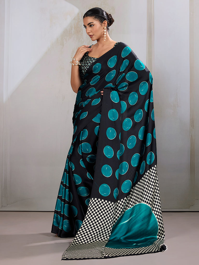 Black and teal satin saree featuring traditional Ajrakh hand block prints.