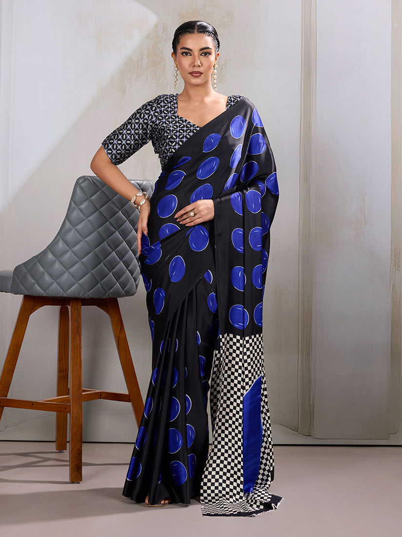 Model wearing a Black and Blue satin saree with traditional Ajrakh hand block print pattern.