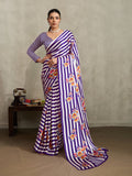 Purple modal satin saree featuring floral and stripe prints with a soft sheen.