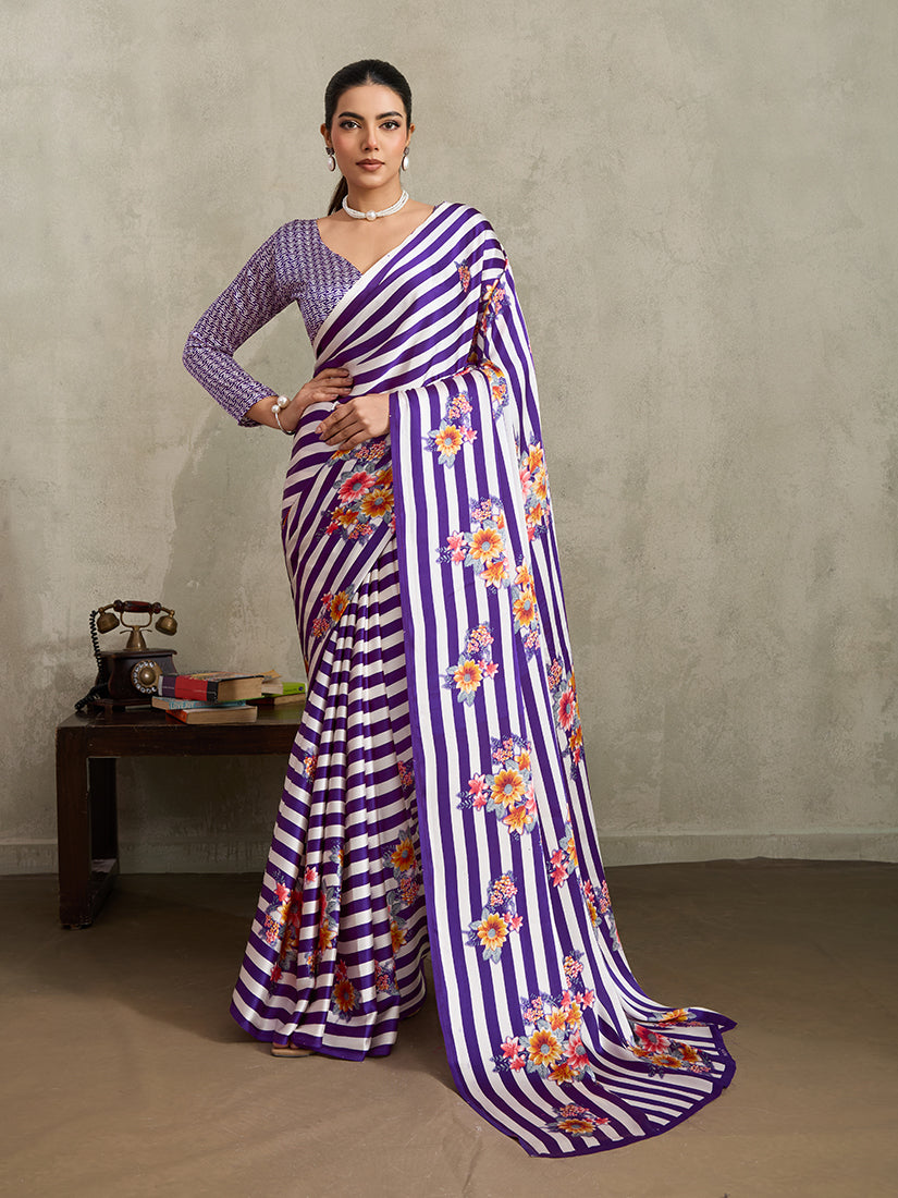 Purple modal satin saree featuring floral and stripe prints with a soft sheen.