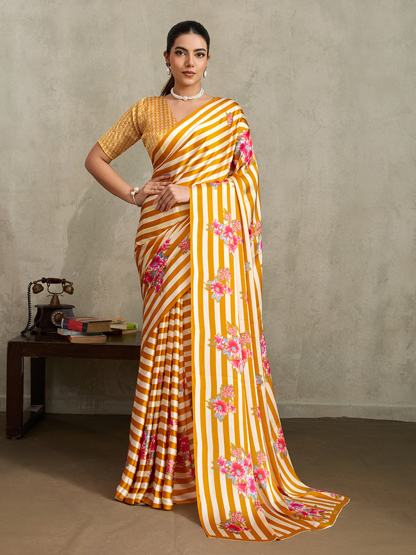Mustard satin saree with stylish vertical stripes and floral prints.