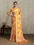 Mustard satin saree with stylish vertical stripes and floral prints.