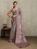 Brown modal satin saree with floral and stripe patterns.