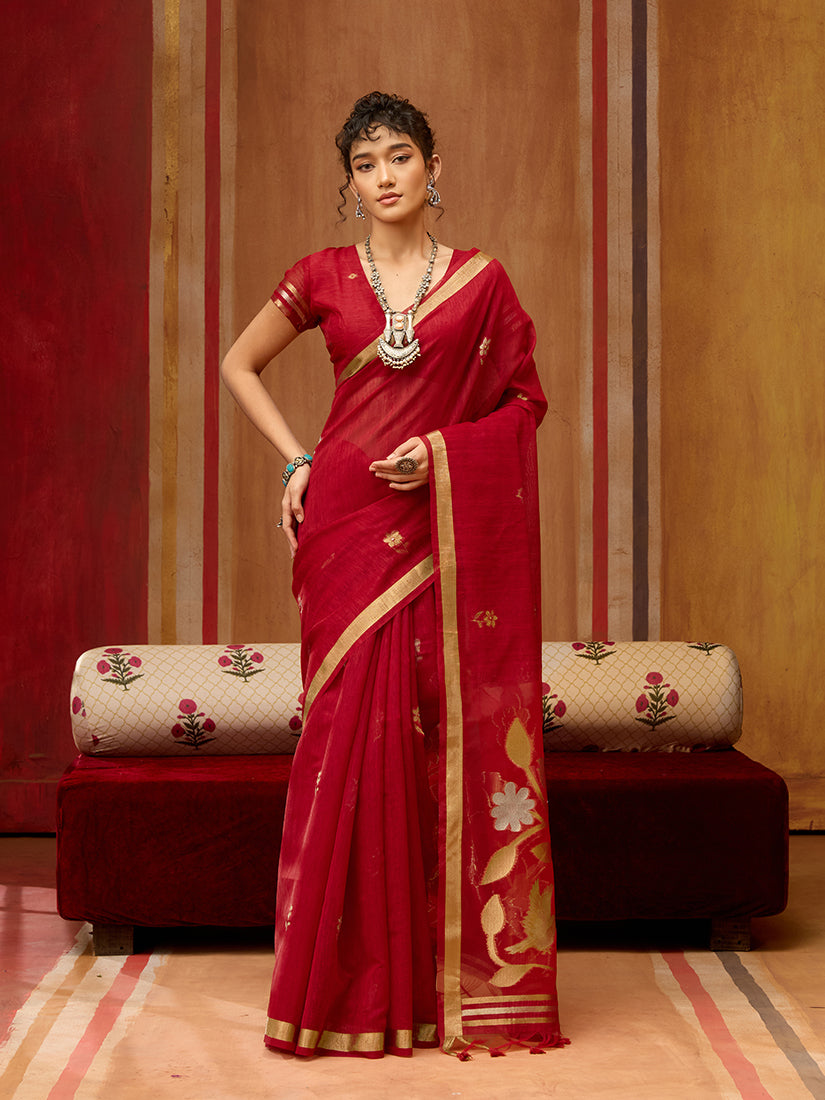 A close-up view of the Red Silk Blend Saree showcasing intricate ethnic woven patterns and rich fabric texture.
