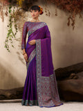 A graceful purple Kanjivaram silk blend saree with traditional woven border and patterns.